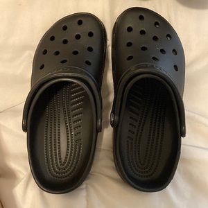 Size 8 crocs. Used once around the house for a few hours.